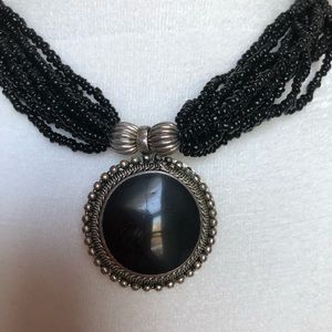 Black beaded necklace w/black stone.